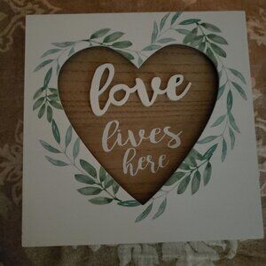 Love Lives Here wood wall hanging